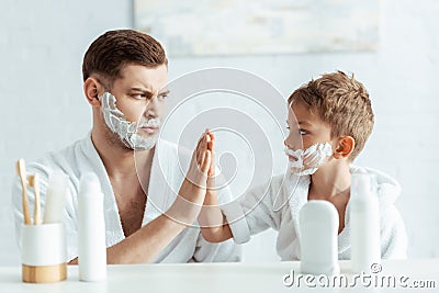 Focus of serious father and son Stock Photo