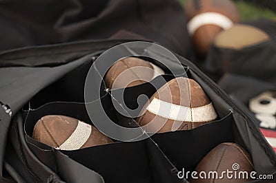 Selective focus shot of a bag with rugby balls Stock Photo