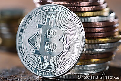 selective focus of silver bitcoin and pile of Stock Photo