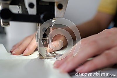 Selective focus on small steel or metallic detail of electric sewing machine Stock Photo
