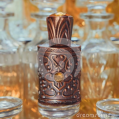 Selective Focus to Ornate Oriental Perfume Bottle close up on blurred Perfume Shop Display. Stock Photo