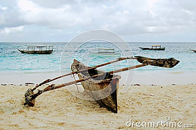 Traditional wooden fishing boat on Nungwi beach, Zanzibar, Tanzania Stock Photo