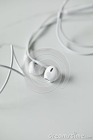 Selective focus of white wired earphones Stock Photo