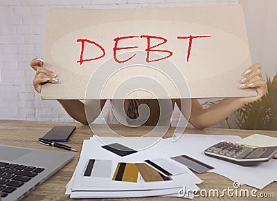 woman hand show a lots of Debtwhich she will pay money as managing credit card debt while Financial probl Stock Photo