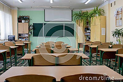 Selective soft and blur focus.old wooden row lecture chairs in classroom in poor school.study room without student.concept for Editorial Stock Photo