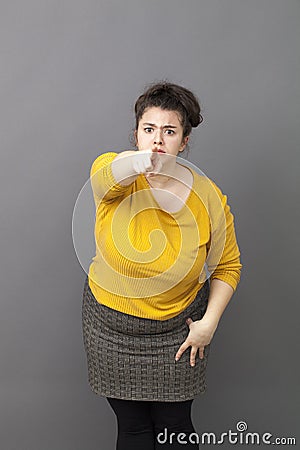 Self-assured 20s woman showing something with focus and confidence Stock Photo