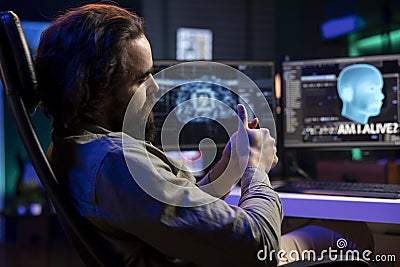 Self aware artificial intelligence becoming alive, talking with IT professional Stock Photo