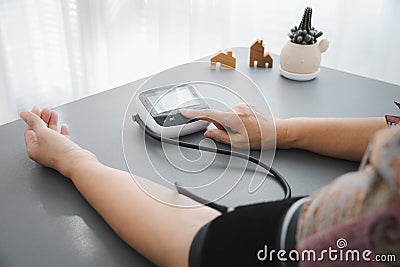 Self blood pressure and heart rate measurement Stock Photo