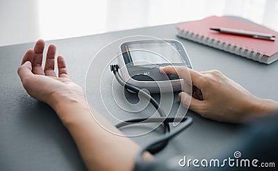 Self blood pressure and heart rate measurement Stock Photo