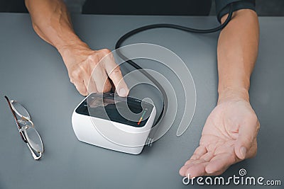 Self blood pressure and heart rate measurement Stock Photo