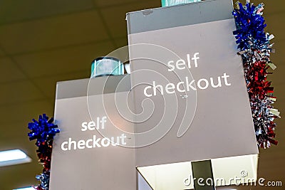 Self Checkout sign in a store Stock Photo