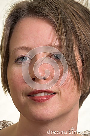 Self confident woman with wind blown hair Stock Photo