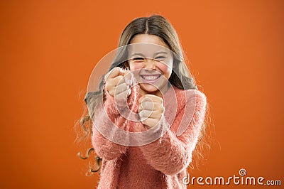 Self defense strategies kids can use against bullies. Girl hold fists ready attack or defend. Girl child cute but strong Stock Photo