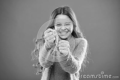 Self defense strategies kids can use against bullies. Girl hold fists ready attack or defend. Girl child cute but strong Stock Photo