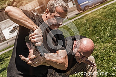 Self defense techniques against a gun Stock Photo