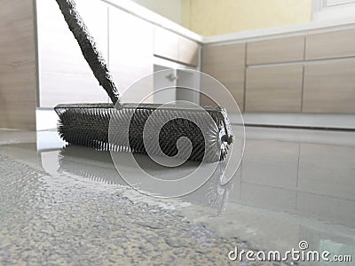 Self-leveling concrete with roller. Stock Photo