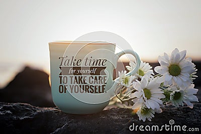 Self love inspirational motivational words - Take time for yourself to take care of yourself. Cup of morning coffee with flowers. Stock Photo