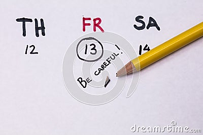 Self-made calendar with Friday 13th and text in English: `Be careful`. Stock Photo