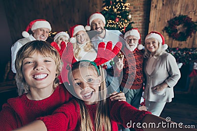 Self photo of large family meeting together with couple of brother sister taking selfie on background of their relatives Stock Photo