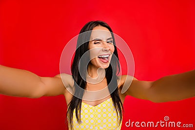 Self portrait of funky, cheerful, pretty, charming, sweet, cute, nice girl shooting selfie on front camera of smart phone winking Stock Photo