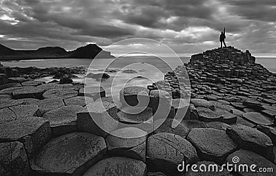 Self portrait in giants Causeway - Black and white Stock Photo