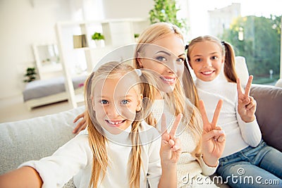 Self-portrait of nice adorable cute attractive lovely winsome charming cheerful cheery people mom mum girls sitting on Stock Photo