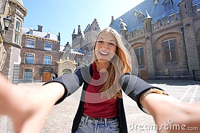 Self portrait of student girl in the courtyard of the Binnenhof complex of buildings in The Hague, Netherlands Stock Photo