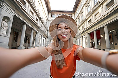 Self portrait of young tourist woman in courtyard of historic Uffizi Gallery art museum in Florence, Tuscany, Italy Stock Photo