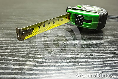 Self-retracting metal tape measure. Stock Photo