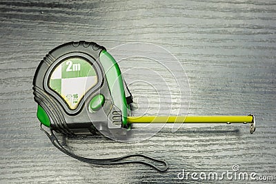 Self-retracting metal tape measure. View from above. Stock Photo