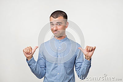 Self-satisfied and proud young man looks forward Stock Photo