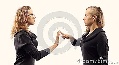 Self talk concept. Young woman talking to herself, showing gestures. Double portrait from two different side views. Stock Photo