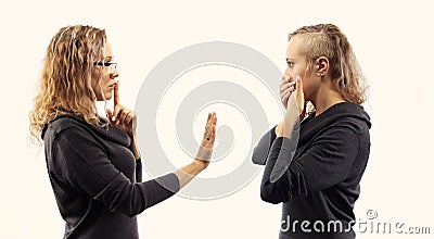 Self talk concept. Young woman talking to herself, showing gestures. Double portrait from two different side views. Stock Photo