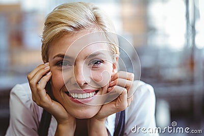 Selfassured female waitress smiling Stock Photo