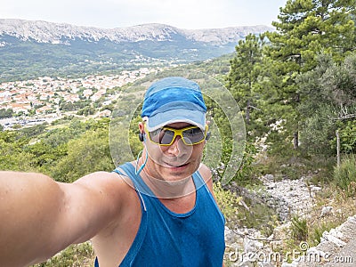 Selfie of cool trailrunning man in croatia on the island krk in baska in summer Stock Photo