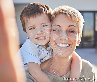 Selfie, grandma and child love to smile, play and bond together outdoor at family home or house. Happy senior, elderly Stock Photo