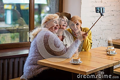 Selfie of ladies in cafe. Stock Photo