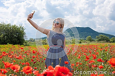 Selfie in the poppy field Stock Photo