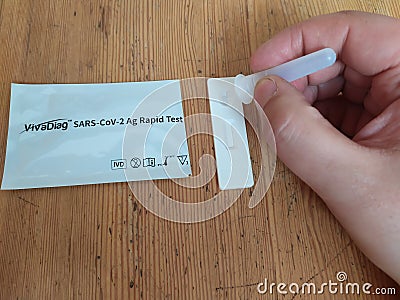 Selftesting rapid test for SARS CoV coronavirus deases, man hand in process Editorial Stock Photo
