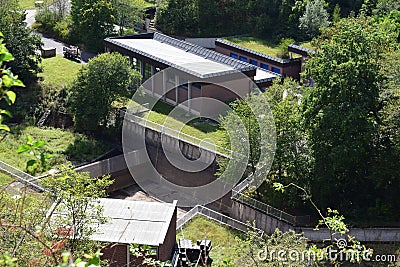 Seligenthal, Germany - 08 19 2020: Buildings below Wahnbachtalsperre with the overflow channel Editorial Stock Photo