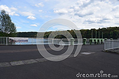 Seligenthal, Germany - 08 19 2020: place with the way entering the dam top of Wahnbachtalsperre and the lake in background Editorial Stock Photo