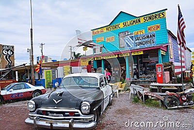 Chrysler Police Car in front of Historic Seligman Sundries Cafe. Editorial Stock Photo