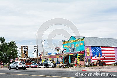 Chrysler Police Car in front of Historic Seligman Sundries Cafe. Editorial Stock Photo