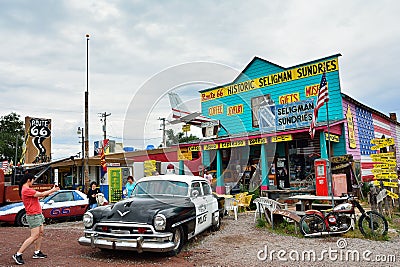 Chrysler Police Car in front of Historic Seligman Sundries Cafe. Editorial Stock Photo