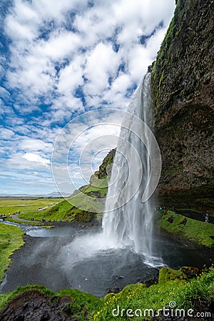 Seljalandsfoss waterfall in Iceland, approaching the back side of the falls Stock Photo