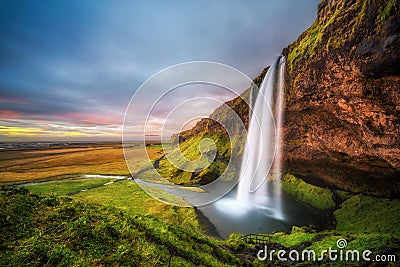 Seljalandsfoss Waterfall in Iceland at sunset Stock Photo