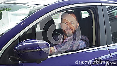 A solid seller sits in the car Stock Photo