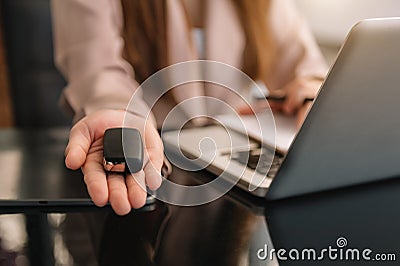 The seller handed over the car key Stock Photo