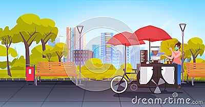 seller in mask standing near small street food market with cupcakes and coffee in urban park cityscape background Vector Illustration