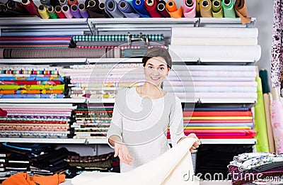 Seller showing white fabric Stock Photo